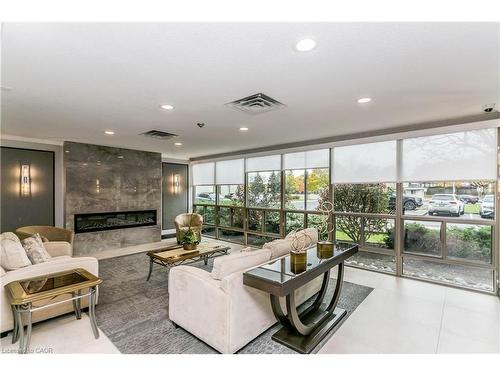 403-5080 Pinedale Avenue, Burlington, ON - Indoor Photo Showing Living Room With Fireplace