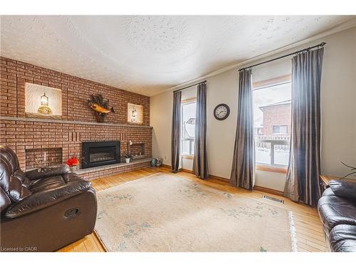 19 Hadeland Avenue, Hamilton, ON - Indoor Photo Showing Living Room With Fireplace