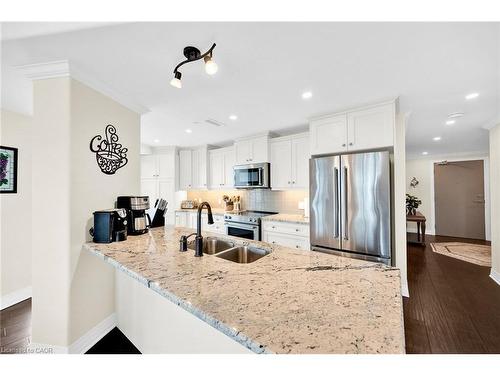 408-10 Concord Place, Grimsby, ON - Indoor Photo Showing Kitchen With Double Sink With Upgraded Kitchen