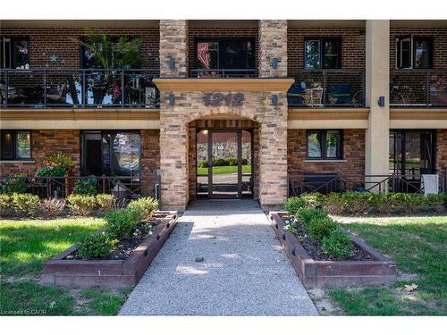 303-1212 Fennell Avenue E, Hamilton, ON - Outdoor With Fireplace