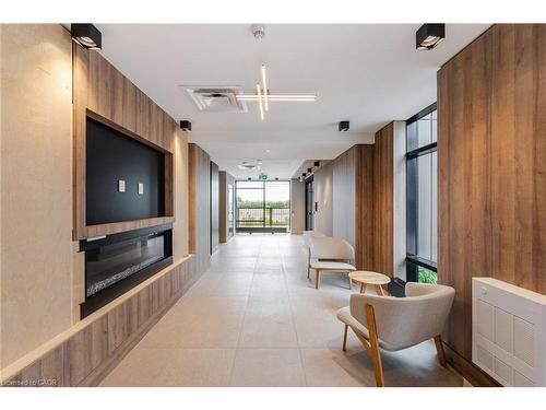 406-335 Wheat Boom Drive, Oakville, ON - Indoor With Fireplace