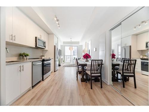 406-335 Wheat Boom Drive, Oakville, ON - Indoor Photo Showing Kitchen With Stainless Steel Kitchen With Upgraded Kitchen