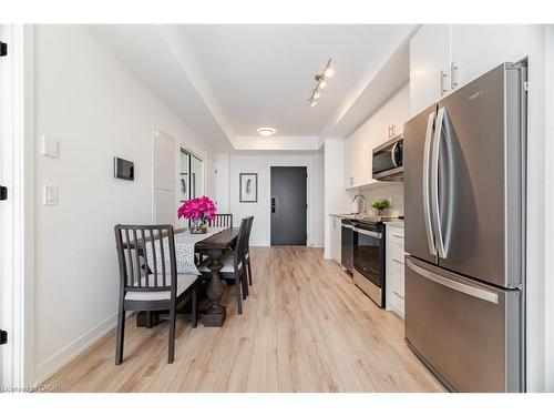 406-335 Wheat Boom Drive, Oakville, ON - Indoor Photo Showing Kitchen With Stainless Steel Kitchen