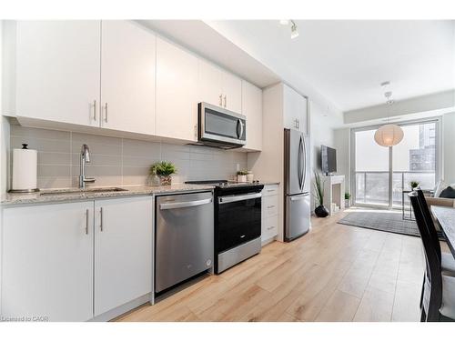 406-335 Wheat Boom Drive, Oakville, ON - Indoor Photo Showing Kitchen With Stainless Steel Kitchen With Double Sink With Upgraded Kitchen