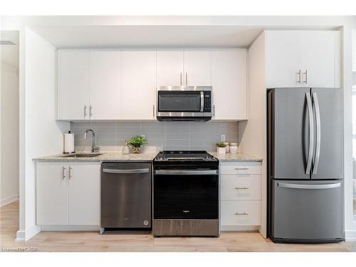 406-335 Wheat Boom Drive, Oakville, ON - Indoor Photo Showing Kitchen With Stainless Steel Kitchen With Upgraded Kitchen