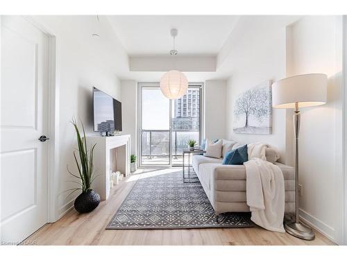 406-335 Wheat Boom Drive, Oakville, ON - Indoor With Fireplace