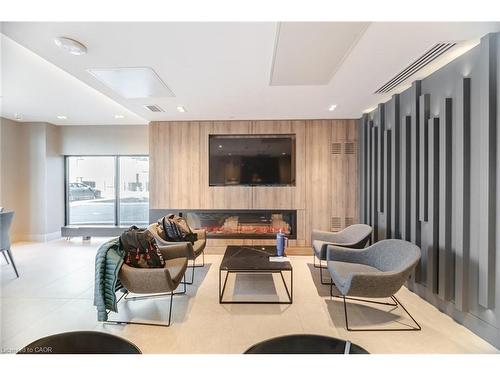 406-335 Wheat Boom Drive, Oakville, ON - Indoor With Fireplace