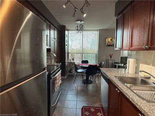 104-4889 Kimbermount Avenue, Mississauga, ON - Indoor Photo Showing Kitchen With Double Sink