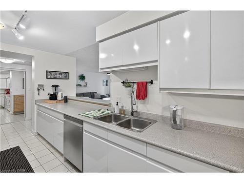 811-1276 Maple Crossing Boulevard, Burlington, ON - Indoor Photo Showing Kitchen With Double Sink