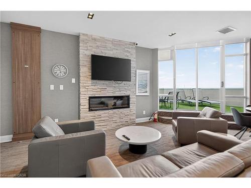 811-1276 Maple Crossing Boulevard, Burlington, ON - Indoor Photo Showing Living Room With Fireplace