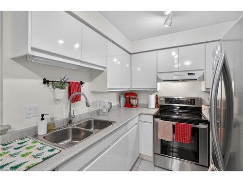 811-1276 Maple Crossing Boulevard, Burlington, ON - Indoor Photo Showing Kitchen With Double Sink