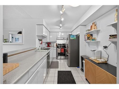 811-1276 Maple Crossing Boulevard, Burlington, ON - Indoor Photo Showing Kitchen With Double Sink
