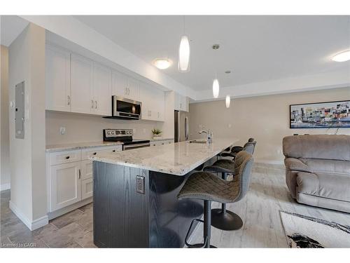 E7-70 Willowrun Drive, Kitchener, ON - Indoor Photo Showing Kitchen With Stainless Steel Kitchen With Upgraded Kitchen