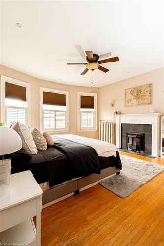 34 Holton Avenue S, Hamilton, ON - Indoor Photo Showing Bedroom With Fireplace