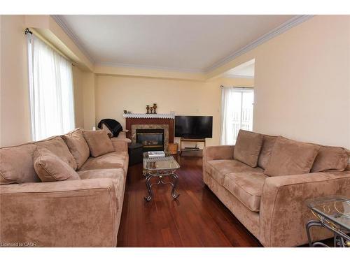 49-7 Southside Place, Hamilton, ON - Indoor Photo Showing Living Room With Fireplace
