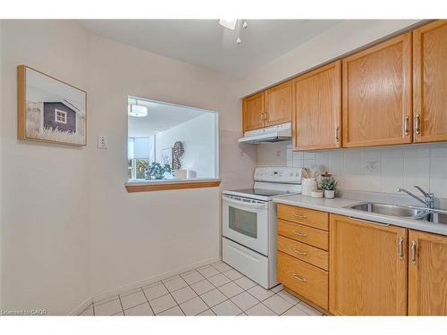 404-1270 Maple Crossing Boulevard, Burlington, ON - Indoor Photo Showing Kitchen With Double Sink