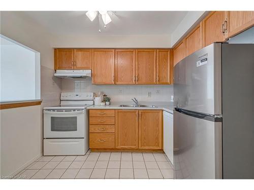 404-1270 Maple Crossing Boulevard, Burlington, ON - Indoor Photo Showing Kitchen With Double Sink