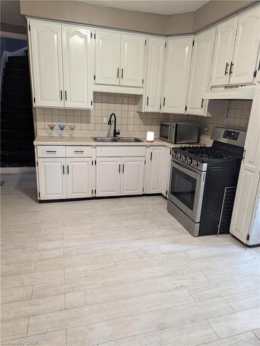 151 Gibson Avenue, Hamilton, ON - Indoor Photo Showing Kitchen With Double Sink