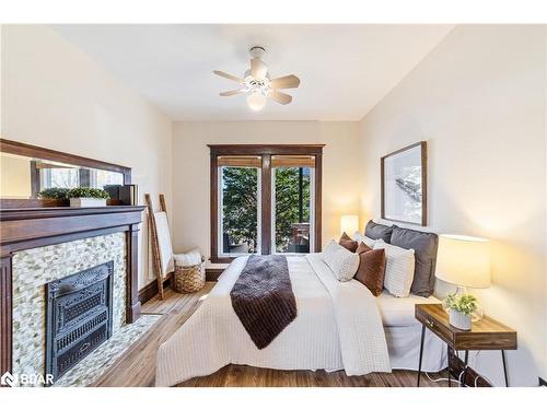 58 Lorne Avenue, Hamilton, ON - Indoor Photo Showing Bedroom With Fireplace