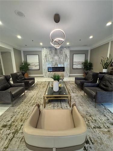 306-75 King Street E, Mississauga, ON - Indoor Photo Showing Living Room With Fireplace