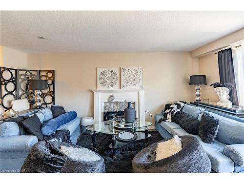 102 Donnenwerth Drive, Kitchener, ON - Indoor Photo Showing Living Room With Fireplace