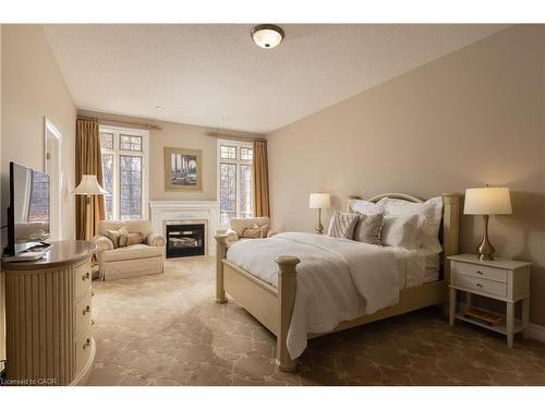 1285 Beaufort Drive, Burlington, ON - Indoor Photo Showing Bedroom With Fireplace