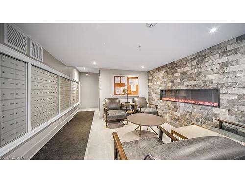 304-610 Farmstead Drive, Milton, ON - Indoor Photo Showing Other Room With Fireplace