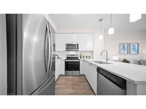 304-610 Farmstead Drive, Milton, ON - Indoor Photo Showing Kitchen With Stainless Steel Kitchen With Double Sink With Upgraded Kitchen