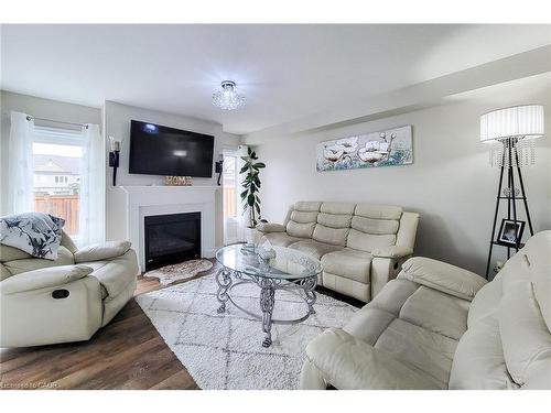 76 Mcallistar Drive, Binbrook, ON - Indoor Photo Showing Living Room With Fireplace