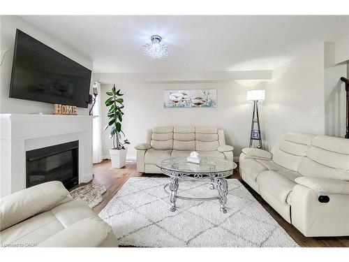 76 Mcallistar Drive, Binbrook, ON - Indoor Photo Showing Living Room With Fireplace