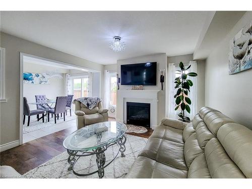 76 Mcallistar Drive, Binbrook, ON - Indoor Photo Showing Living Room With Fireplace
