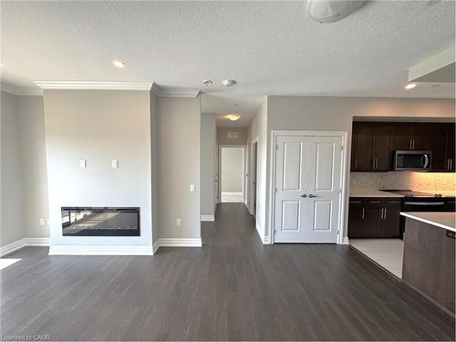 1003-1880 Gordon Street, Guelph, ON - Indoor Photo Showing Kitchen With Fireplace