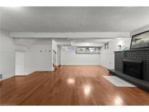 215 Berkindale Drive, Hamilton, ON - Indoor Photo Showing Living Room With Fireplace