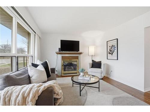 131 Nash Road N, Hamilton, ON - Indoor Photo Showing Living Room With Fireplace