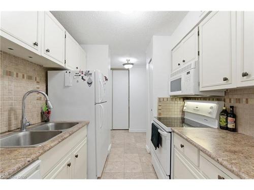 502-222 Jackson Street W, Hamilton, ON - Indoor Photo Showing Kitchen With Double Sink