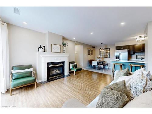 2-2333 Walker'S Line, Burlington, ON - Indoor Photo Showing Living Room With Fireplace