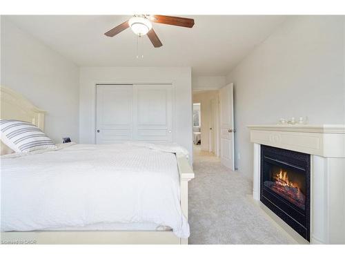 35-222 Fall Fair Way, Binbrook, ON - Indoor Photo Showing Bedroom With Fireplace