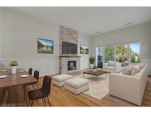 006-39 Sister Varga Terrace, Hamilton, ON - Indoor Photo Showing Living Room With Fireplace