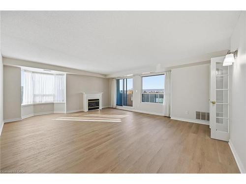 802-1272 Ontario Street, Burlington, ON - Indoor Photo Showing Living Room With Fireplace
