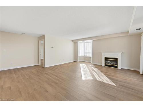 802-1272 Ontario Street, Burlington, ON - Indoor Photo Showing Living Room With Fireplace