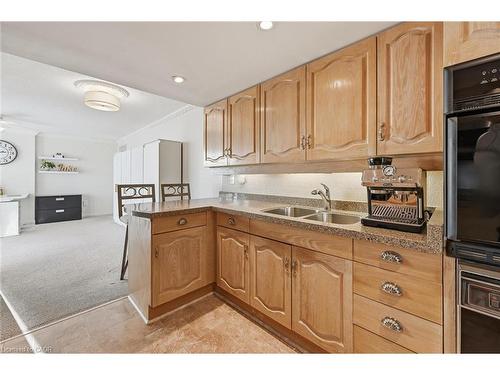 1808-2170 Marine Drive, Oakville, ON - Indoor Photo Showing Kitchen With Double Sink