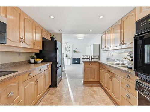 1808-2170 Marine Drive, Oakville, ON - Indoor Photo Showing Kitchen With Double Sink