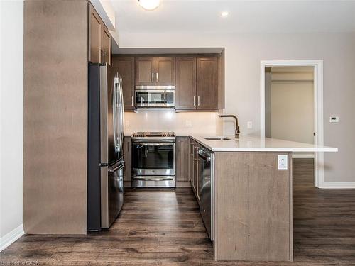 412-1105 Leger Way, Milton, ON - Indoor Photo Showing Kitchen With Stainless Steel Kitchen