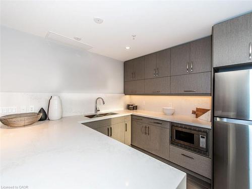 412-1105 Leger Way, Milton, ON - Indoor Photo Showing Kitchen With Stainless Steel Kitchen With Double Sink With Upgraded Kitchen