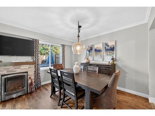 2-4198 Longmoor Drive, Burlington, ON - Indoor Photo Showing Dining Room With Fireplace
