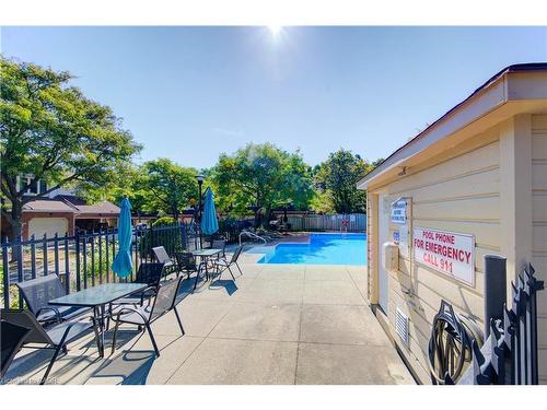 5-523 Beechwood Drive, Waterloo, ON - Outdoor With In Ground Pool