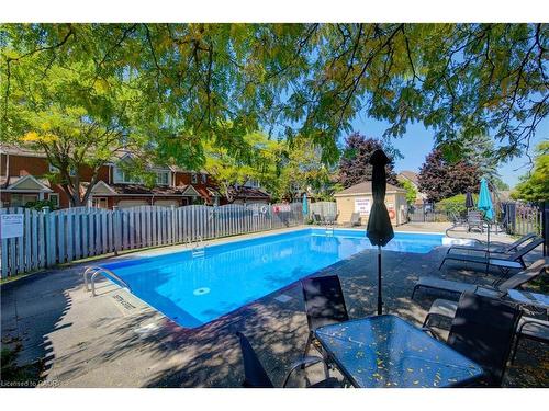 5-523 Beechwood Drive, Waterloo, ON - Outdoor With In Ground Pool With Backyard