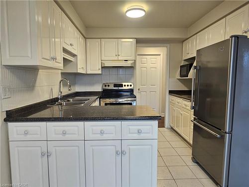 11E-67 Caroline Street S, Hamilton, ON - Indoor Photo Showing Kitchen With Double Sink