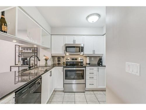 701-4080 Living Arts Drive, Mississauga, ON - Indoor Photo Showing Kitchen With Double Sink