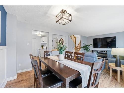 510B Rosemeadow Crescent, Waterloo, ON - Indoor Photo Showing Dining Room With Fireplace